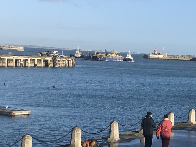 Dun Laoghaire Harbour: A barge laden with Cornish granite is moved by a pair of tugs, AMS Retriever and Vanguard in advance of towage to off the port's East Pier where operations took place to discharge rock-armour due to damage caused by Storm Emma in 2018. 