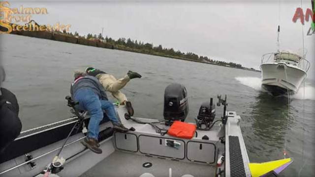 Three people are seen in still from video posted on magazine Salmon Trout Steelheader's Facebook page jumping into Columbia River at its mouth at the Pacific Ocean in Oregon in August 2017 moments before speeding boat barrelled down on theirs and hit it 