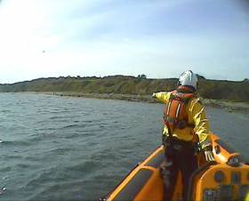 A volunteer crew member with Skerries RNLI spots a garda waving from shore