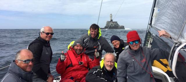 Tectonic shift? Fingal islet of Rockabill nears the Fastnet Rock?? Leading the Dun Laoghaire-Dingle Race approaching the Fastnet Rock, the JPK 10.80 Rockabill VI’s crew are ahead on the water and on handicap, but ace helm Mark Pettit (left) doesn’t at all approve of frivolity. However, photographer Will Byrne managed to get a smile out of (left to right) Ian O’Meara, Rees Kavanagh, Conor O’Higgins, Peter Wilson, Ian Heffernan and heavily disguised owner-skipper Paul O’Higgins