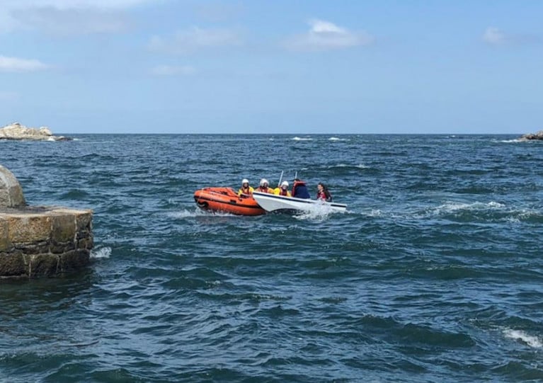 Dun Laoghaire’s inshore lifeboat assisting the small rowing boat on Sunday afternoon