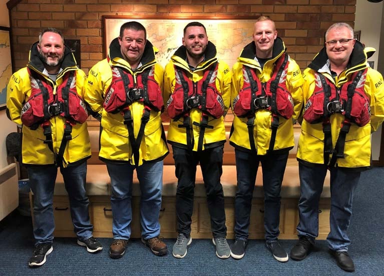The lifeboat crew from Castletownbere who are to receive RNLI Gallantry Awards for a rescue. L – R: Lifeboat crewmember John Paul Downey, Lifeboat Mechanic Martin O’Donoghue, Coxswain Dean Hegarty, Lifeboat crewmember Dave Fenton and Lifeboat crewmember Seamus Harrington