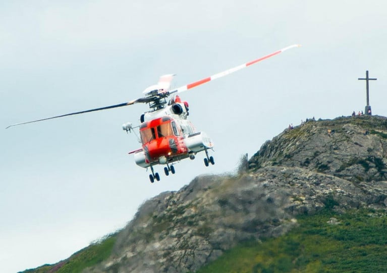 Rescue 116 flying with Bray Head in the background