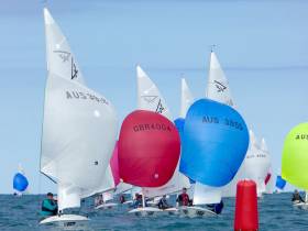 National Yacht Club pair Charles Apthorp and Alan Green (red spinnaker GBR 4004) were second in race four yesterday