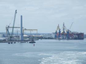 Dong Energy facility (on left) with backdrop of H&amp;W&#039;s famous Samson &amp; Goliath cranes and oil platforms at the marine engineering facility on Belfast Lough