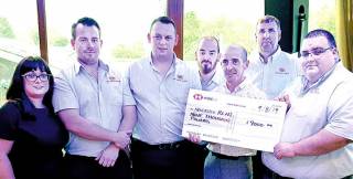 Ruth’s fiancé Jim Griffin presents a cheque for £9,000 to Newcastle RNLI’s station coxswain Nathan Leneghan (right) and fellow crew members who were involved in the search, from left, Sean Cunningham, station mechanic Shane Rice, Gerry McConkey and David Hughes. Also included is Newcastle RNLI’s Lifeboat Operations Manager, Lisa Ramsden.