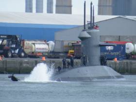 The distinctive &quot;X&quot; tail stern configuration of Dutch submarine HNLMS Walrus with wash generated when swinging off Ocean Pier in Alexandra Basin in Dublin Port. At this same pier is where currently a sister, HNLMS Zeeleeuw is docked alongside support ship HNLMS Mercuur. 