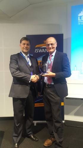 Ronald Spithout President of Inmarsat presents ISWAN award to Liverpool Seafarer Centre CEO John Wilson during LISW2019