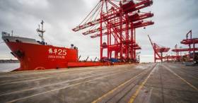 New cranes totaling three built in China onboard a heavy-lift vessel alongside the Liverpool2 container terminal 