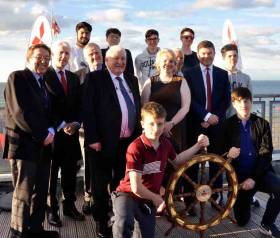 Spanning the generations. At the award of the Mitsubishi Motors “Sailing Club of the Year 2017” trophy to Wicklow Sailing Club were (back row, left to right) Cillian Ballesty, Robert Bell King, Carl Somers, Kieran Fitzgerald and Ryan Fitzgerald, (middle row) W M Nixon, Billy Riordan (CEO Frank Keane Holdings), Jack Roy (President Irish Sailing Association), Frank Keane (Chairman FKH, owners of Mitsubishi Motors Ireland), Denise Cummins (Commodore, Wicklow SC (2017-2018), Hal Fitzgerald (Commodore WSC 2015-2016), and Gerard Rice (MD, Mitsubishi Motors) (front row) Jack Cummins and Hal Og Fitzgerald. Photo: Angela Ballesty