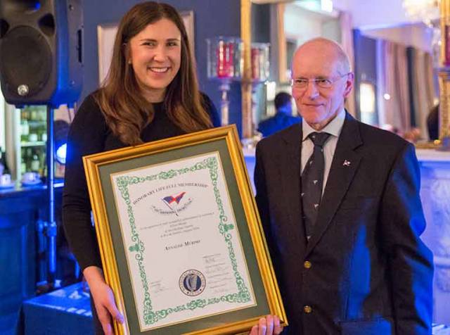 Outgoing National Yacht Club Commodore Larry Power with NYC member Annalise Murphy at the awards night. Scroll down for photo gallery