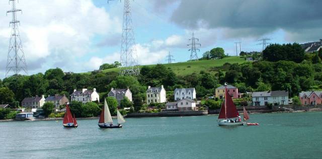 Drascombes Going Upriver off Monkstown in Cork Harbour