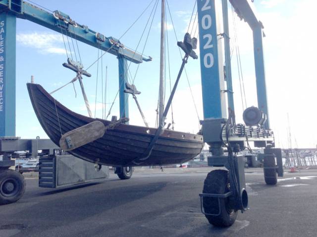 A Viking longship is lifted into the water on the MGM Boatyard hoist at Dun Laoghaire's Coal Harbour this morning