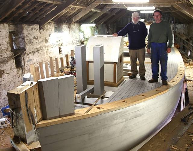 Dermot Kennedy with Liam Hegarty on the almost-completed new deck of the ketch Ilen at Oldcourt near Baltimore on Saturday
