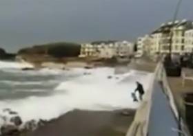 A still from the video showing the child swept off their feet by the wave at Portstewart’s promenade