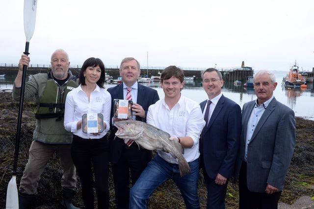 Jim Kennedy of Atlantic Sea Kayaks, Monica Buckley and Peter Shanahan of The Fresh Fish Deli in Rosscarbery, Marine Minister Michael Creed, BIM chief Jim O'Toole and Finian O'Sullivan, chair of FLAG South pictured at Ballycotton Harbour at the announcement of a €3.6 million Fisheries Local Area Action Group (FLAG) fund for Ireland’s seven coastal regions