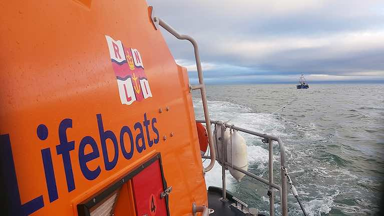 Wicklow RNLI all-weather lifeboat towing the fishing vessel into Wicklow harbour