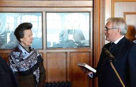 The magic book. The Princess Royal receiving the special copy of Lord Dufferin’s Letters from High Latitudes from Myles Lindsay, Vice Commodore, at the recent reception in the Royal Ulster YC