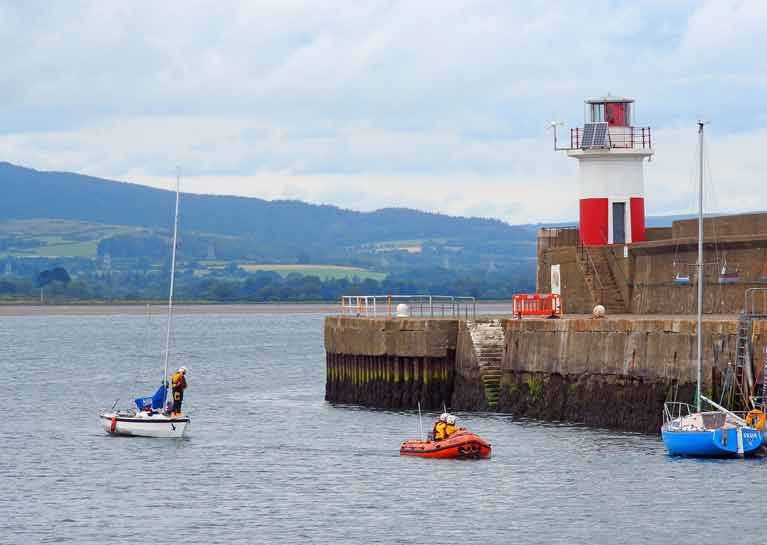 A towline was established and the yacht with two sailors was brought safely alongside the East pier at Wicklow harbour