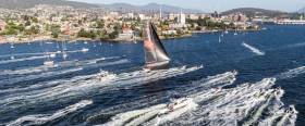 Wild Oats X1 approaching the finish in the heart of Hobart harbour to take line honours in the Rolex Sydney-Hobart Race 2018. Thanks to her speed, though the actual wind is from aft of the beam, she seems to be on a close reach