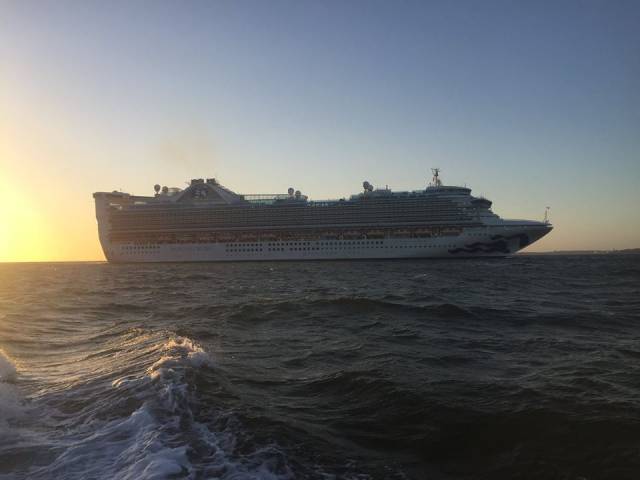 Princess Cruises 'Grand' class cruiseship, Caribbean Princess arriving on Belfast Lough and seen bound for the city's dedicated cruise berth at Stormont Wharf.
