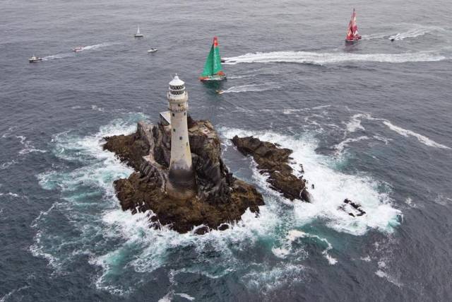 Groupama Sailing Team and CAMPER with Emirates Team New Zealand round Fastnet Rock on Leg 9 of the 2011-12 Volvo Ocean Race