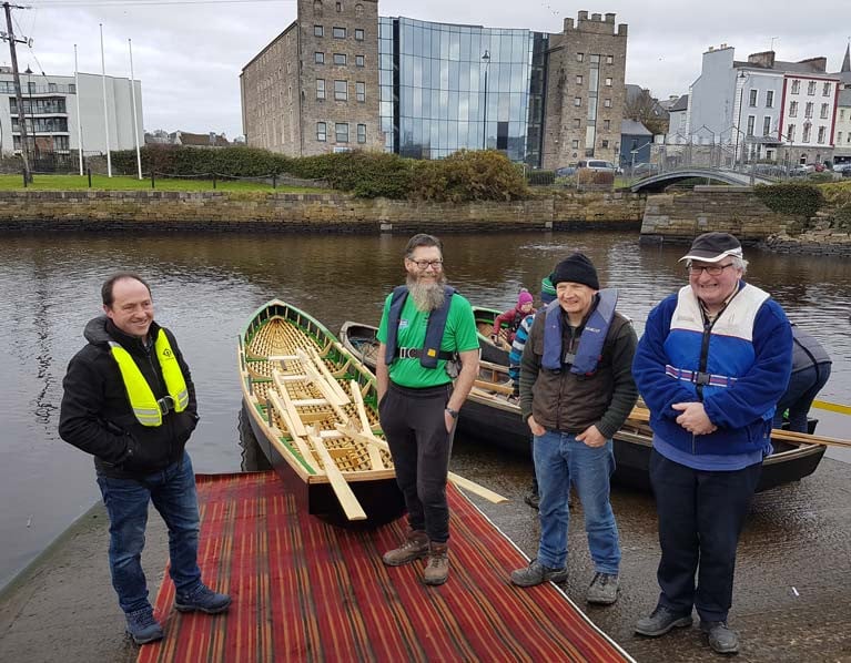 The replica currach was built by James Madigan (left) with help from club members