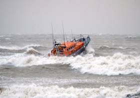 Newcastle RNLI&#039;s Mersey class lifeboat breaking the waves off the Co Down coast