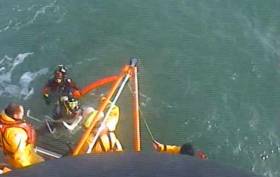 The RNLI All-Weather lifeboat located the casualties south-east of the Muglins Rock fifteen minutes after launching