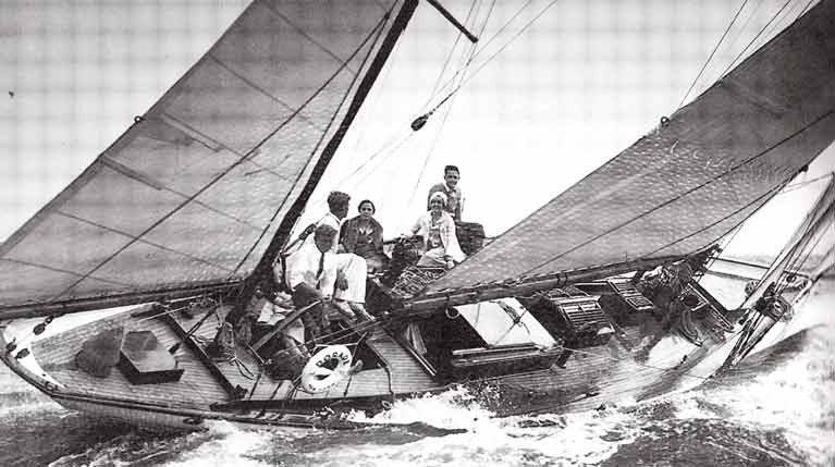 This could well be the maiden sail of the famous Dorade in 1930, as the inappropriately-dressed group in the cockpit – with Olin Stephens (22) on the helm and his brother Rod (20) beside him -look as though they came for a launch party, and decided to go for a brisk sail as well, even if no-one had brought proper sailing gear - note the slightly bewildered-looking guy on the weather rail wearing a bow tie