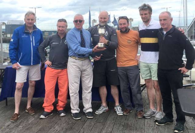 Jibe presented with Eastern Championship trophy by Ian Byrne, Commodore Howth Yacht Club  (from left to right : Brian McDowell J/24 Association President, Fergus Kelliher, Ian Byrne Commodore HYC, Brendan Culloty, Michael McCormack, Timothy Kelliher, Mark Mulrooney)