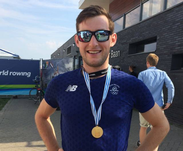 Paul O'Donovan with his gold medal in Rotterdam today. Scroll down for video