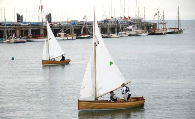Traditional Water Wags Number 41 Mollie (Claudine Murphy) and Number 45 Mariposa, (Cathy MacAleavey) sail past the assembled Classic boat fleet at the Carlisle Pier adjacent to the National Yacht Club in Dun Laoghaire
