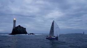 The RNLI Baltimore team sailing the yacht True Penance rounds the Fastnet Rock last night in the first race of Cork Week&#039;s Beaufort Cup