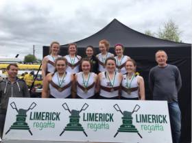 Cork Boat Club, the women&#039;s junior 18 eight winners at Limerick Regatta. Included are coaches Stephen Murphy and Terence McGrath. 