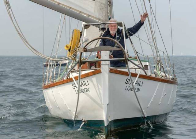 Sir Robin Knox Johnston on Suhaili celebrates his 50th anniversary of becoming the first person to sail solo and non stop around the world