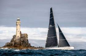 Rambler 88 rounds the Fastnet on her way to monohull line honours victory