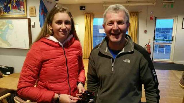 Laser Frostbite race winner, Radial sailor Claire Gorman from the National Yacht club collects her prize from DMYC's Neil Colin