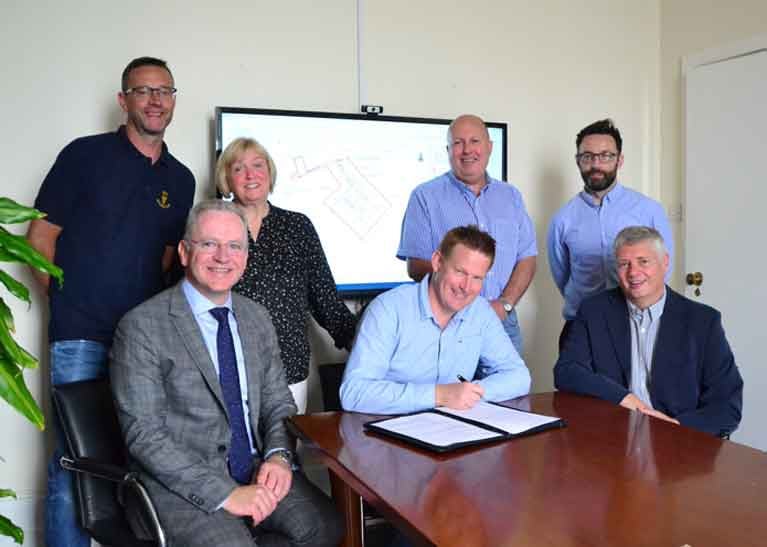 Signing the contract for Cobh Marina: Richard Marshall, Anne Ahern, Micheál O’Driscoll and Damian Ahern, committee members of Cove Sailing Club, with Paul Murphy of Byrne Looby and local councillor Cathal Rasmussen