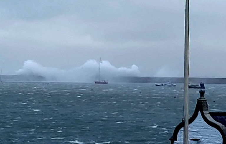 Ferry operator blames 'inaccurate' weather forecasts as Storm Barra caused for day-long sailings to Holyhead. They were unable to dock because of rough seas, as Afloat adds the scene above shows the breakwater of the north Wales port. 