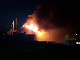 The scene in north Wales as a fire devastates a workshop premises in Holyhead Marina.