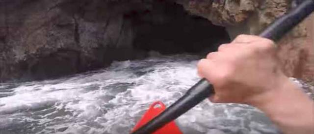 Iain Miller at the entrance to the sea cave at Umfin Island off the Donegal coast. Scroll down for video.