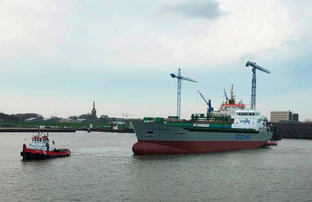 Scot Carrier with tugs fore and aft prior to taking to the seas for first trials. The newbuild, the largest to join the ScotLine fleet that regularly call to Irish ports. 