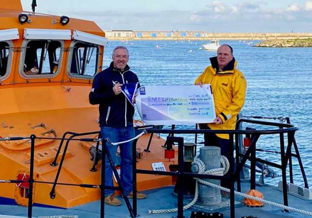 Swords Sailing & Boating club Vice Commodore Patrick Wodhams presents a cheque to Steven Harris of Howth RNLI