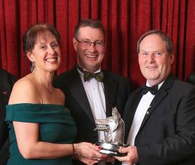 Mojito co-skippers Vicky Cox and Peter Dunlop receiving the Wolf’s Head Trophy from Peter Ryan of ISORA at the annual awards ceremony in the National YC in November