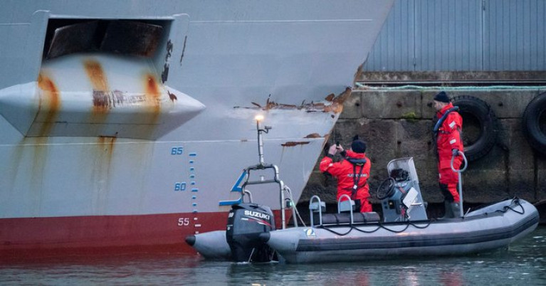 Personnel from the Swedish Coast Guard investigate the damaged British (registered) ship Scot Carrier in the port of Ystad, Sweden following collision with the Danish Karin Hoej in the Baltic Sea. 