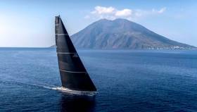 George David’s Rambler 88 arrives at Stromboli – she was soon virtually becalmed for hours, but now has all the wind she needs