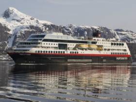 Hurtigruten&#039;s &#039;Milleninnium&#039; class Norwegian coastal voyages cruiseship Trollfjord that can also take cars. The 2002 built vessel made a promotional call to Dun Laoghaire Harbour early in her career.