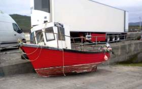 The vessel on slipway at Cleggan with name and fishing number on board on port side of wheelhouse