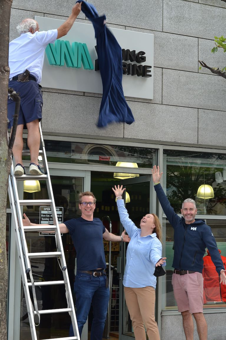 Ian O'Meara (on ladder) unveils the new logo at the Viking Marine store at the Pavilion in Dun Laoghaire Harbour with Gerard Whelan, Brand Central Design who created the new brand, Antonia O Rourke Viking Marine, Paddy Kirwan of Helly Hansen